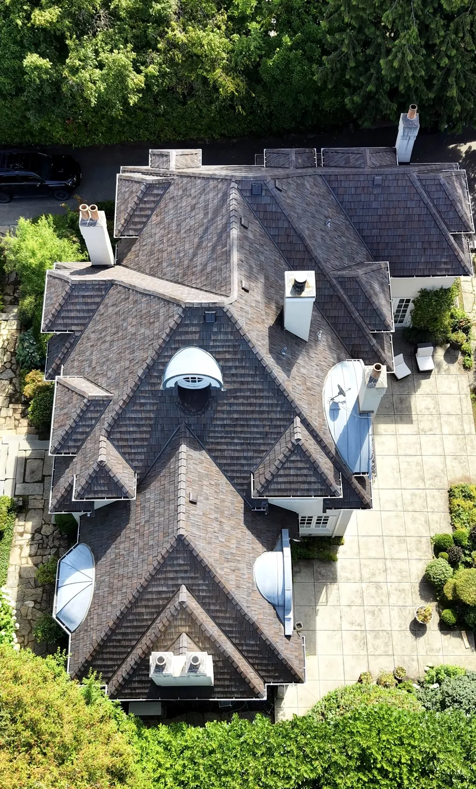 Top-down aerial — Brava composite shake tile roof detail showing authentic colour variation