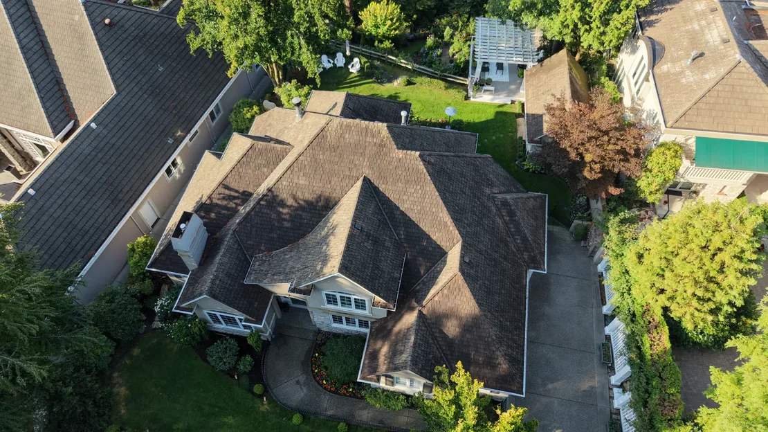 Eagle Mountain home before reroofing — aged, weathered asphalt shingle roof seen from above