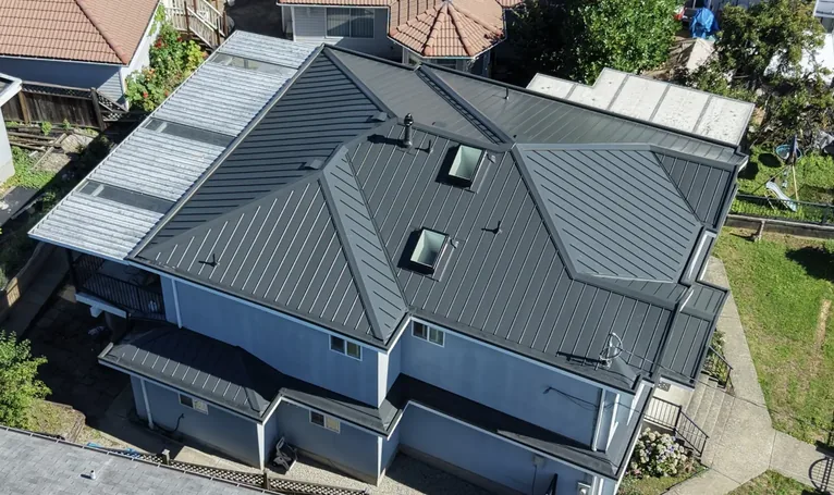 Standing seam metal roof with skylights, completed installation &mdash; Lower Mainland BC